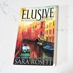 Sara Rosett Elusive On The Run International Mystery Novel Book Paperback